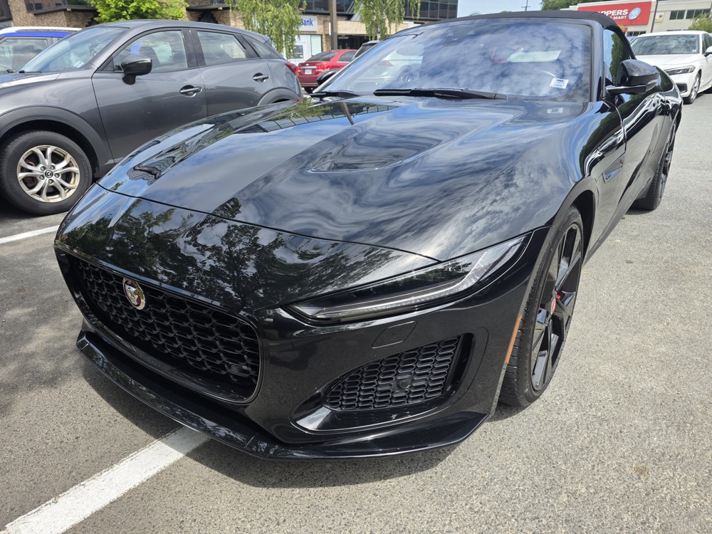 Black Jaguar F-Type with a mirror-gloss finish after a full detail
