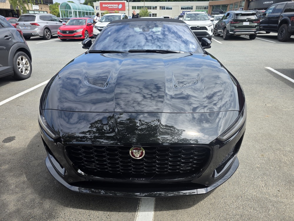 Freshly detailed black sports car with a mirror-gloss finish